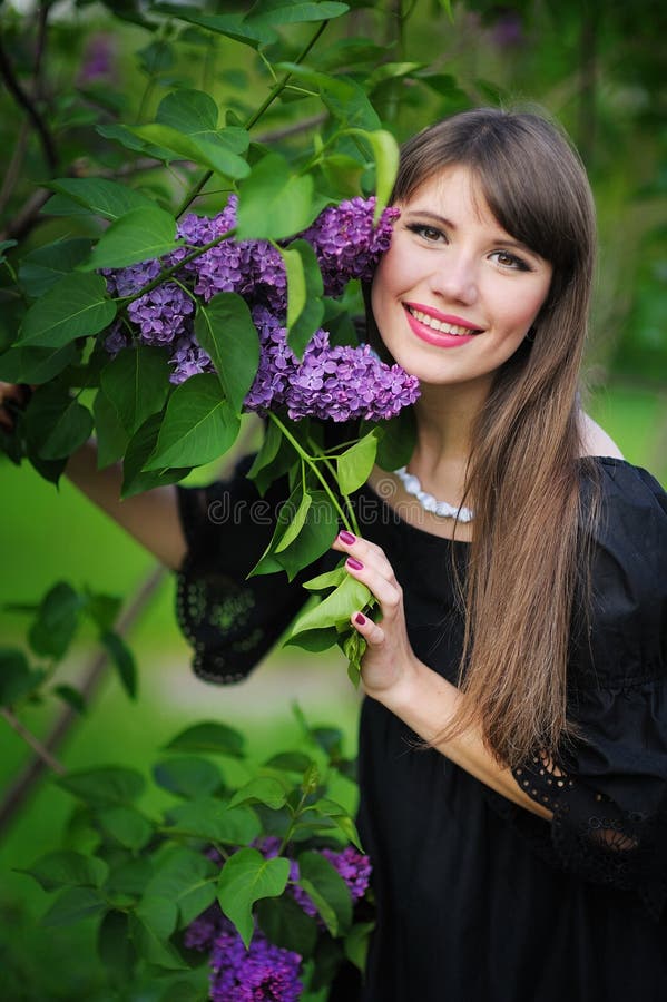 Woman with lilac stock photo. Image of flower, delight - 28627772