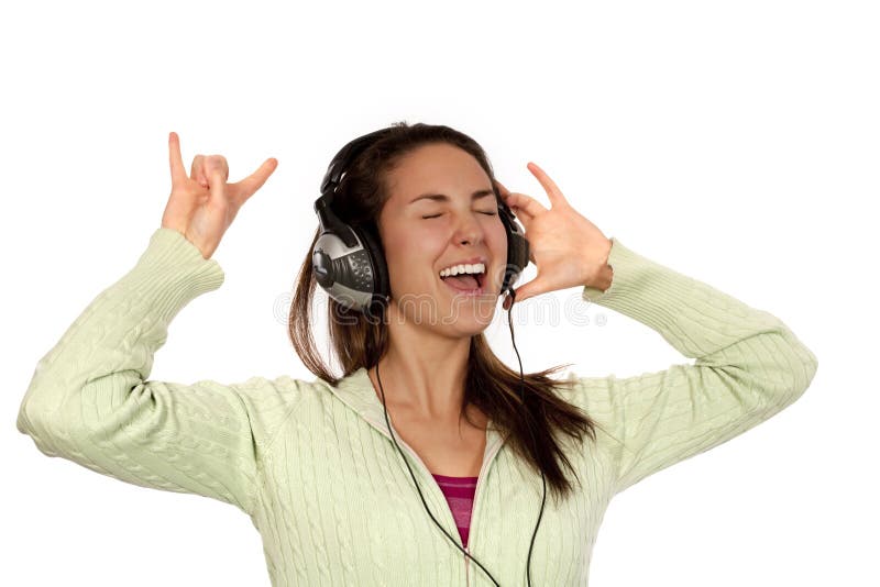 Woman listening loud music over white background wearing green t-shirt