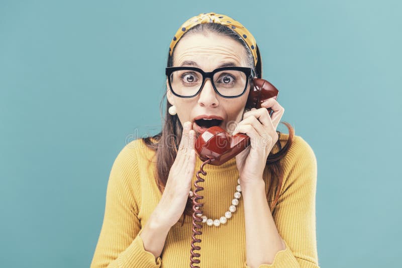 Woman listening to interesting gossips on the phone