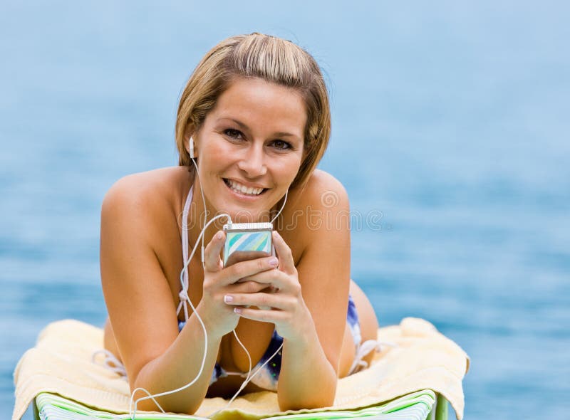 Woman listening to mp3 player