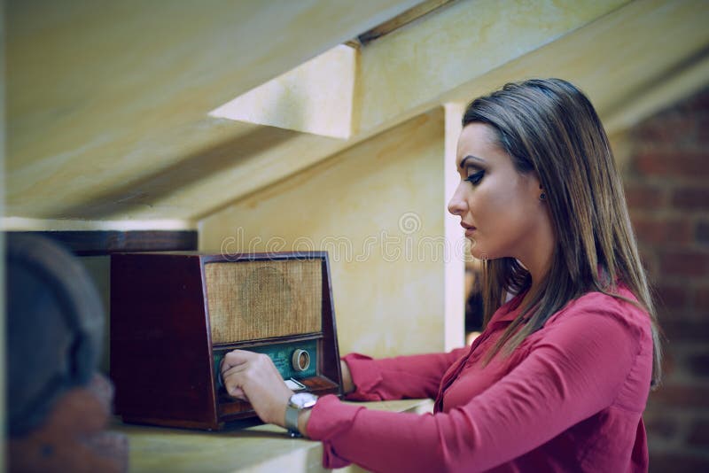 Woman listening to a retro radio