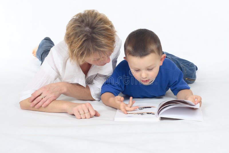 Woman and little boy seeing book