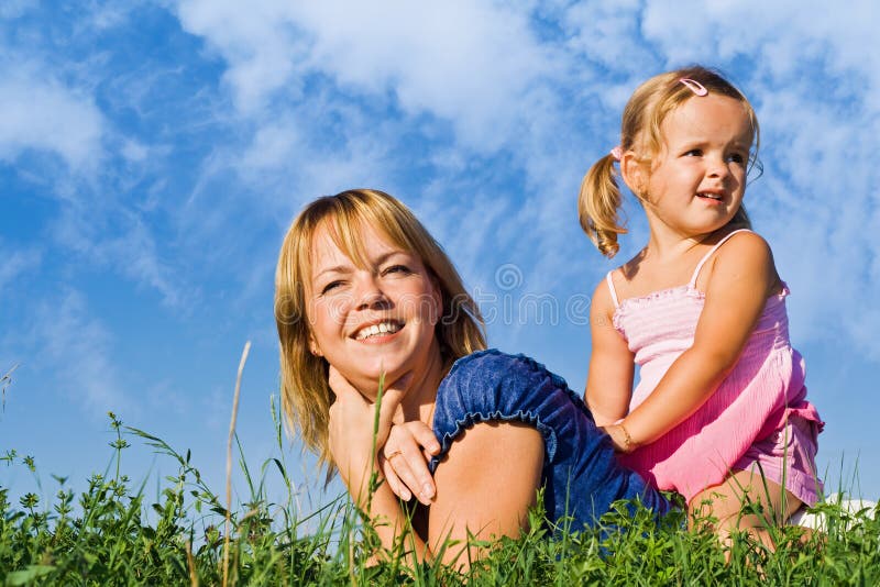 Woman and little girl in the grass