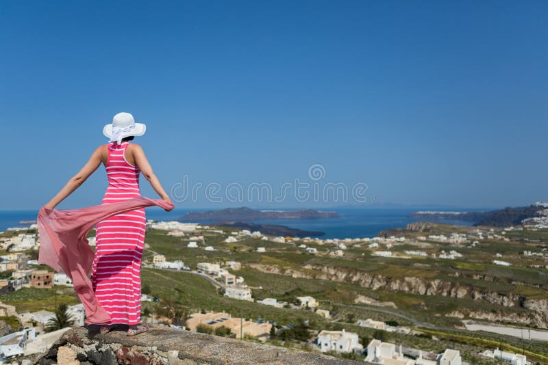 Woman in a long dress, island Santorini, Greece.