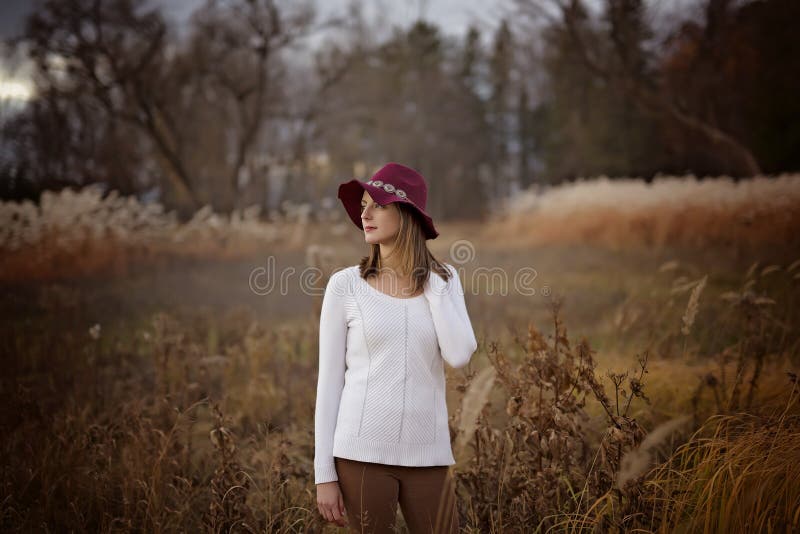 Woman with long hair, fedora hat