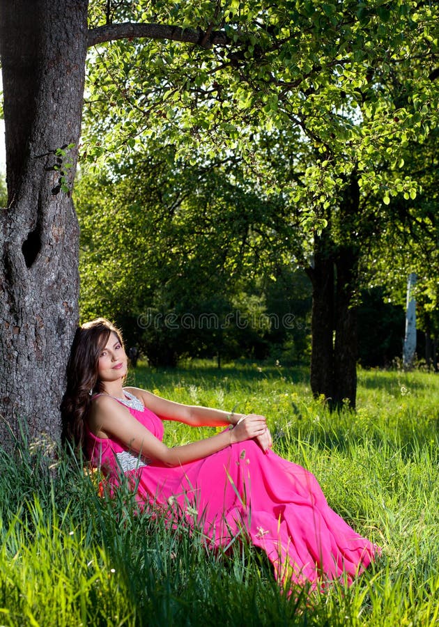 Woman in a long pink dress