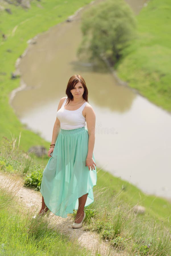 Free Photos - A Woman Wearing A Skirt, Likely A Fashionable Dress, As She  Poses For A Photo Shoot. She Is Standing In Front Of A Backdrop Of Ruffled  Tulle, Creating An
