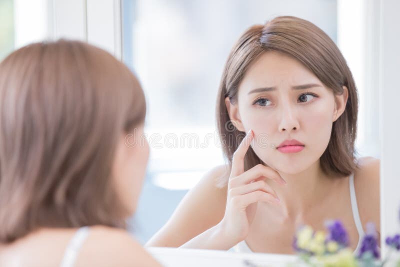 Woman look mirrior feel upset and touch her face with acne problem. Problem wrinkle stock images, royalty-free photos and pictures