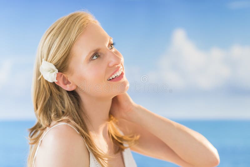 Woman Looking Away Against Sea At Beach stock image Woman Looking Away Against Sea At Beach stock image