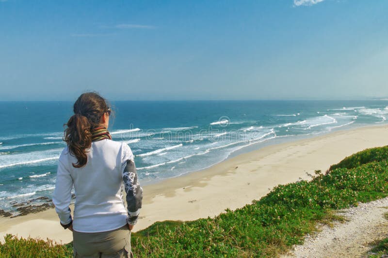 Woman looking at beautiful ocean view