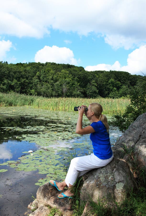 Woman looking through binoculars