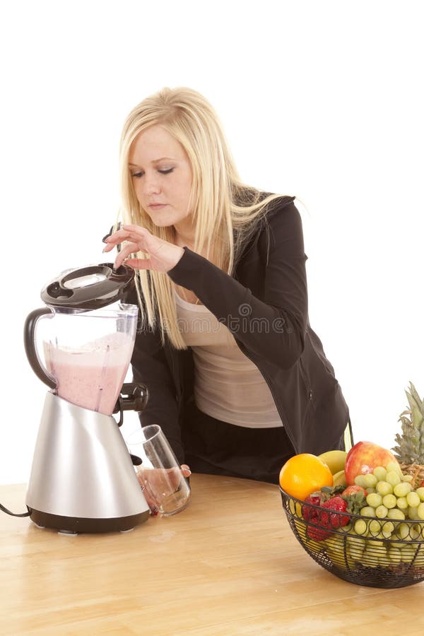 Woman looking in blender