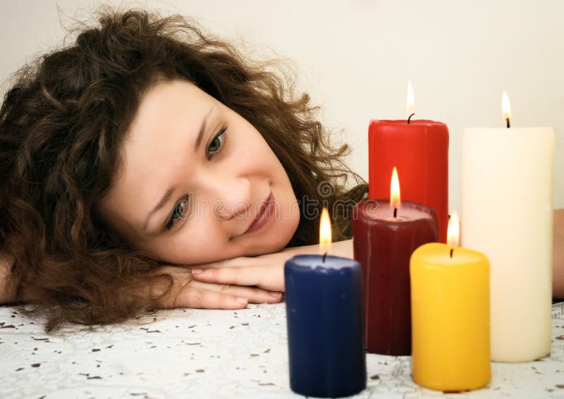 Woman looking at candles stock images