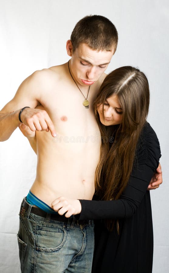 Woman looking into the man`s jeans