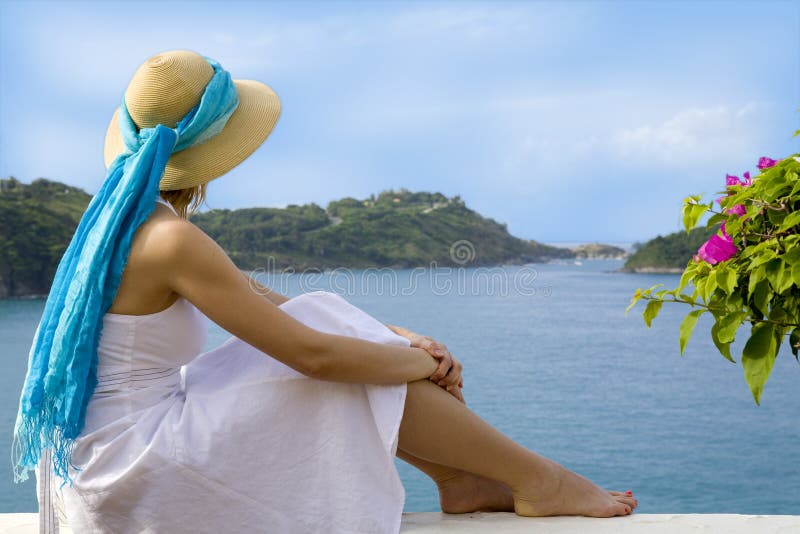 Woman looking at an ocean view stock image Woman looking at an ocean view stock image