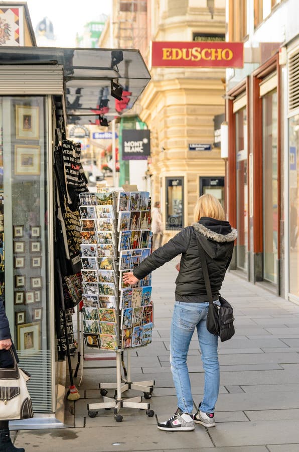 Woman looking at postcards on Graben St., old town main street of Vienna, Austria. stock photography Woman looking at postcards on Graben St., old town main street of Vienna, Austria. stock photography