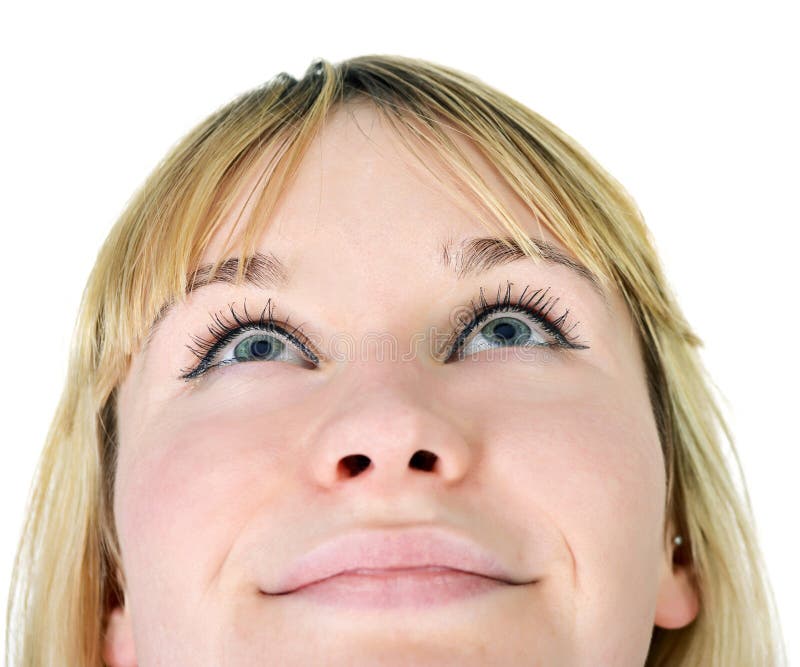 Beautiful young woman looking up