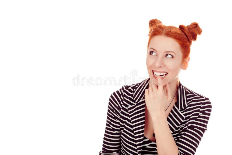 Woman looking up to the side dreaming and smiling happy