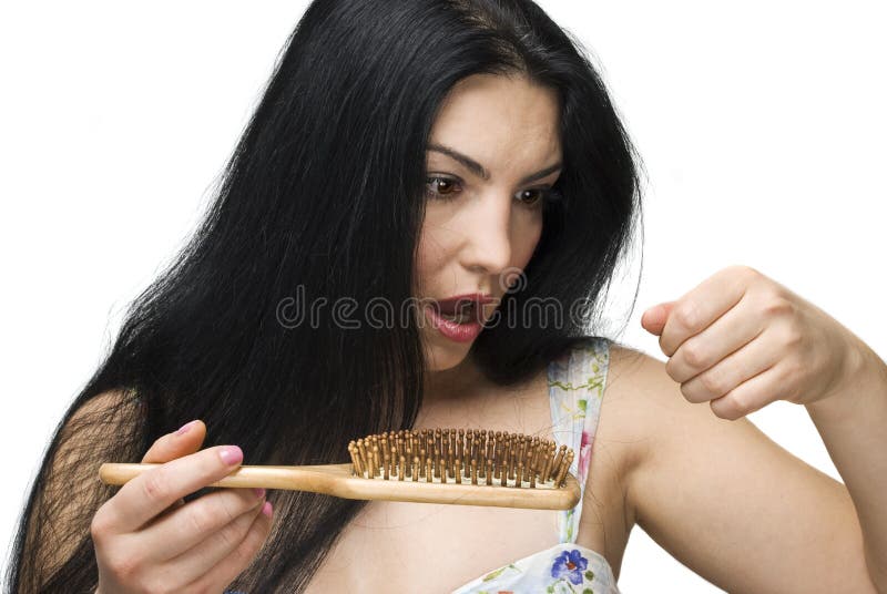 Shocked woman making a face because losing hair on hairbrush isolated on white background.Check also. Shocked woman making a face because losing hair on hairbrush isolated on white background.Check also