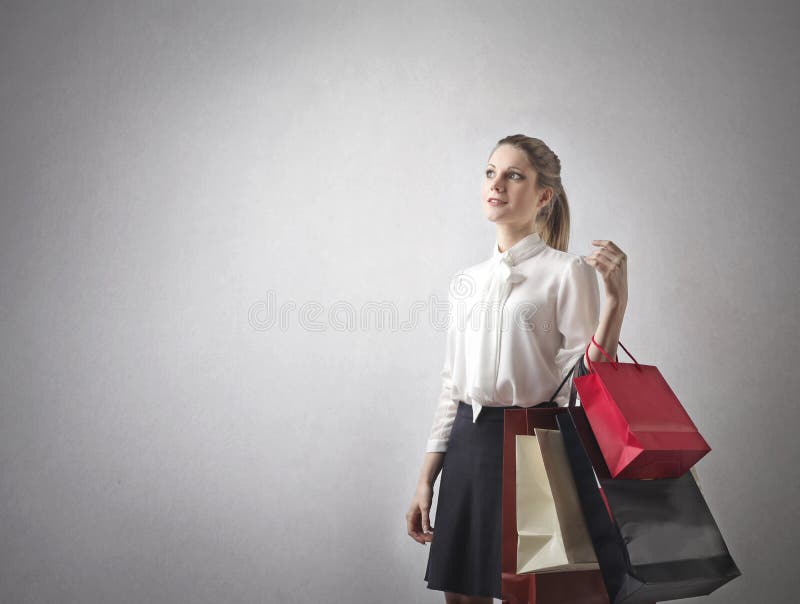 png An attractive woman looking excited while holding up shopping bags   Buy Stock Photo on PeopleImages, Picture And Royalty Free Image. Pic  2835822 - PeopleImages