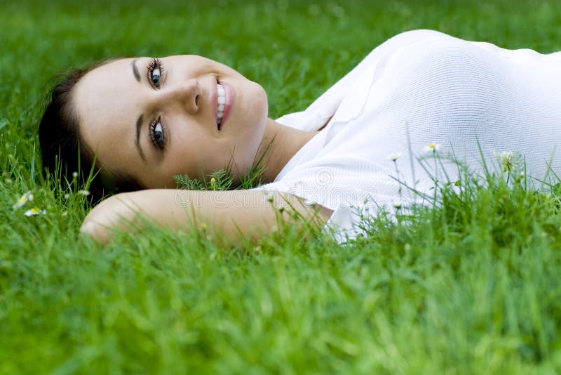 Woman lying on grass