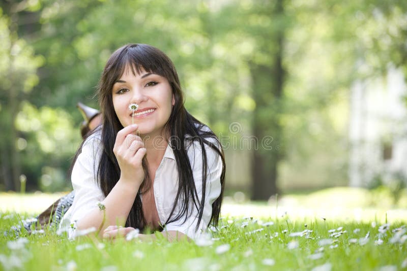 Woman lying on grass