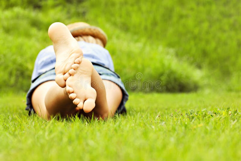 Woman lying on grass royalty free stock photos