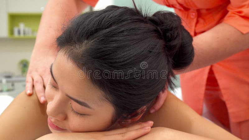 Woman lying on massage table.