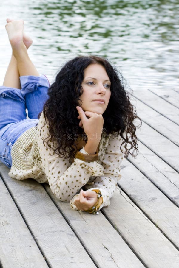 Woman lying near the river