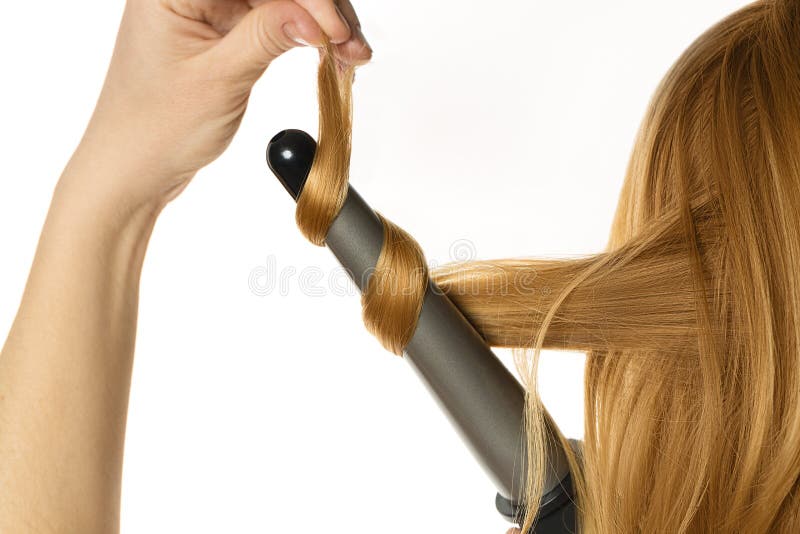 Woman makes a curling hair by herself