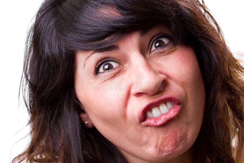 Woman makes a funny face. Attractive young woman makes a funny face for the camera royalty free stock photography Woman makes a funny face. Attractive young woman makes a funny face for the camera royalty free stock photography