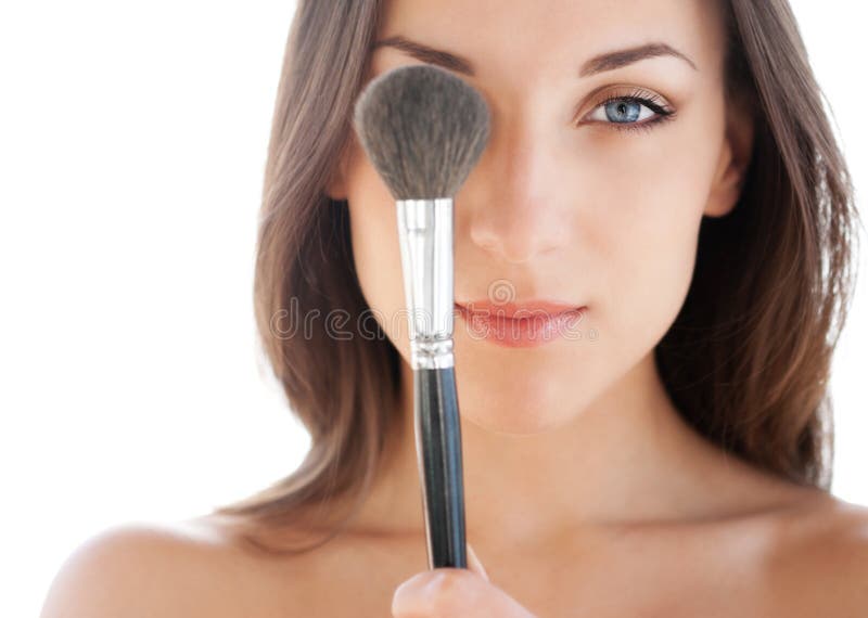 Woman with makeup brush