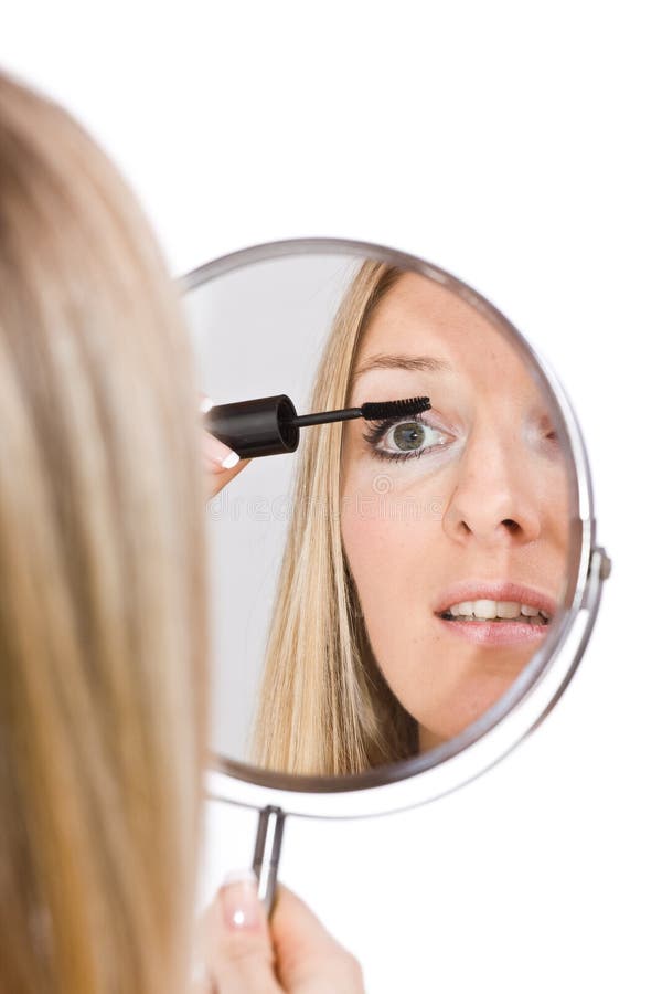 Woman makeup in mirror