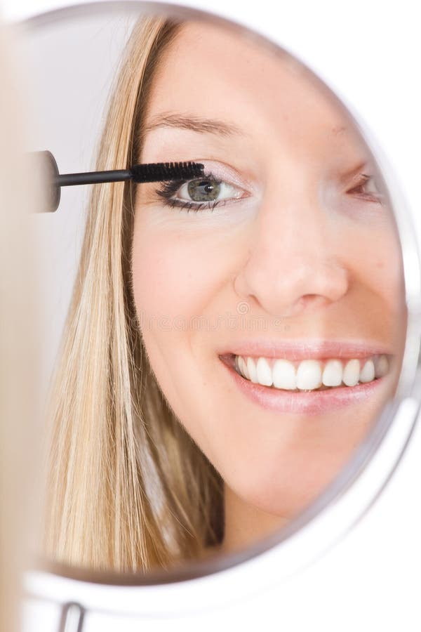 Woman makeup in mirror