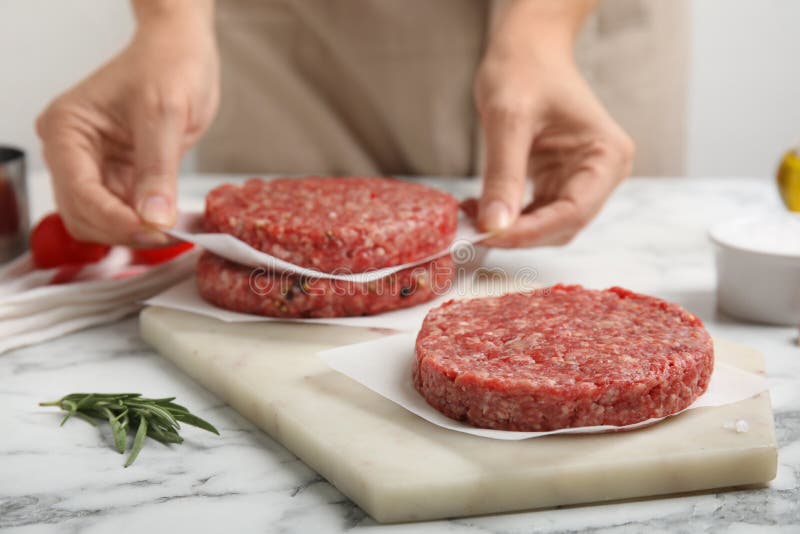 Woman Making Hamburger Patties at White Marble Table, Closeup Stock