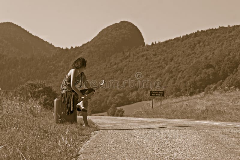 Woman making of hitch-hiking