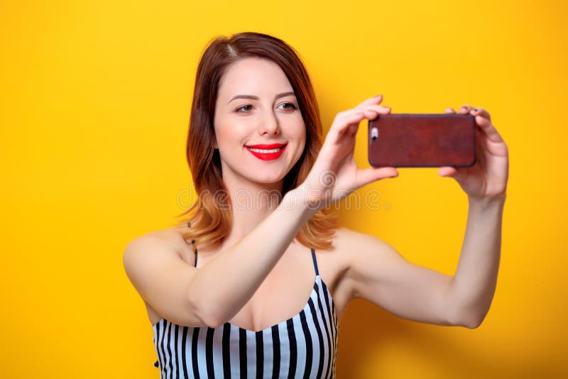 Woman Making Selfie On Yellow Background Stock Image - Image of