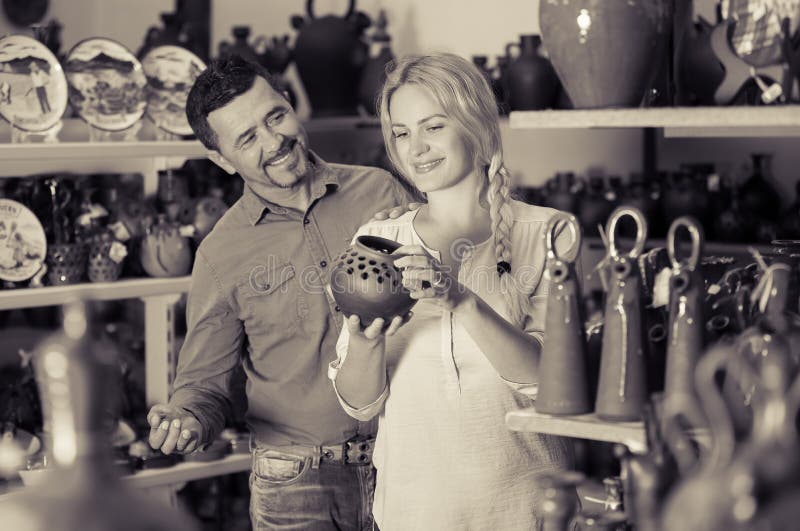 Woman and man buying vase royalty free stock photo Woman and man buying vase royalty free stock photo
