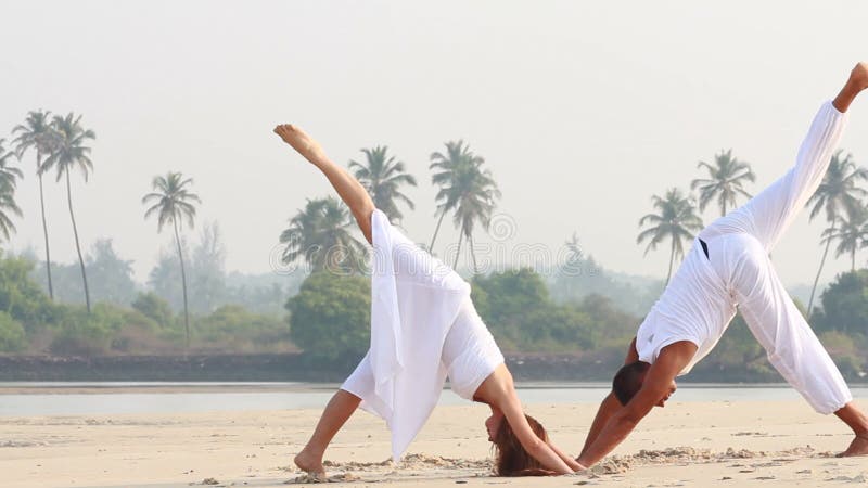 Woman and man doing yoga