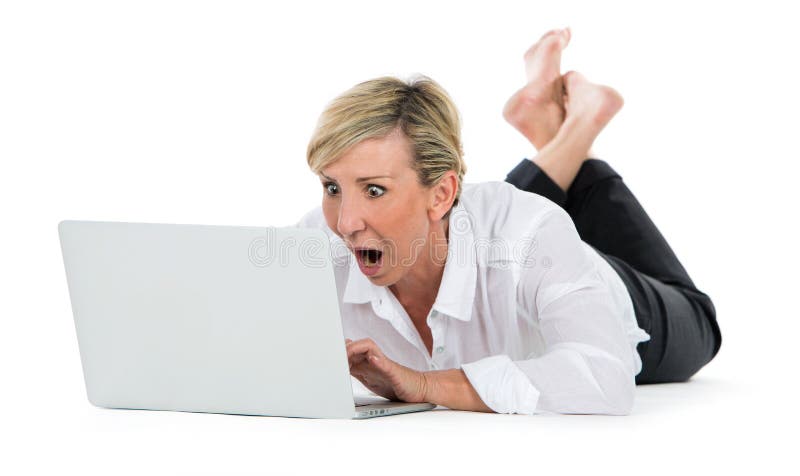 Woman manager sat on the floor with laptop stock photo