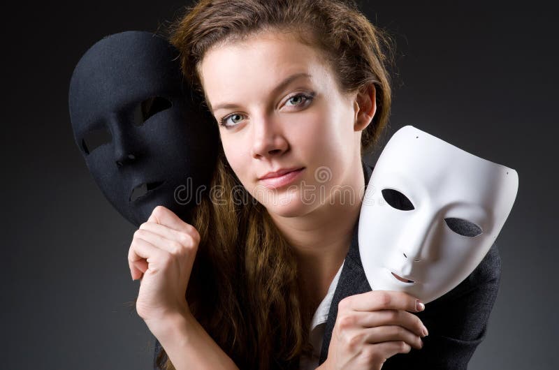 Woman with the mask in hypocrisy concept