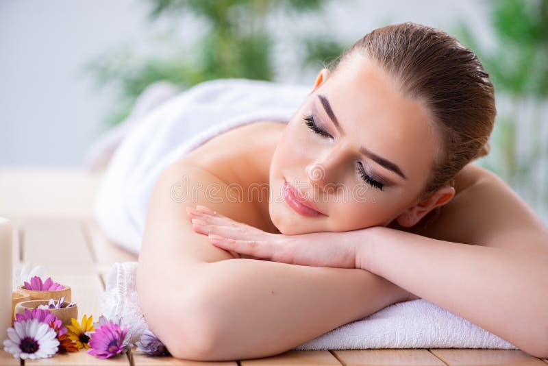 The woman during massage session in spa. Aromatherapy, bodycare.