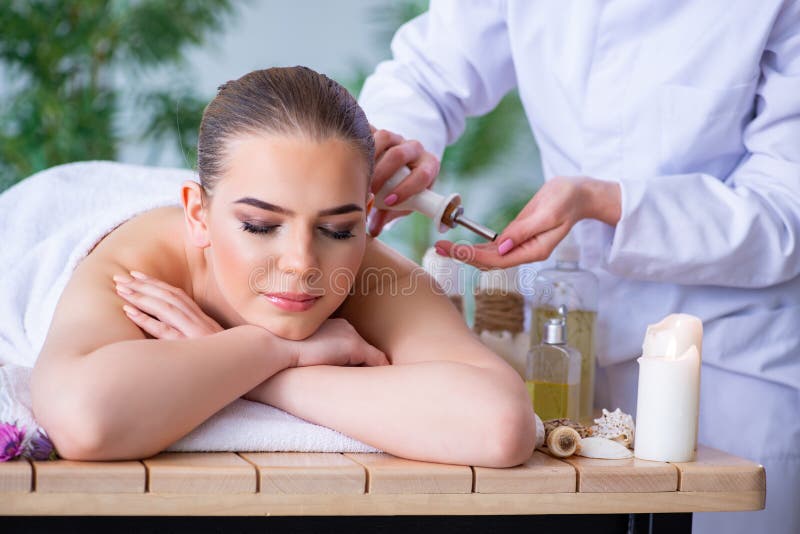 The Woman During Massage Session In Spa