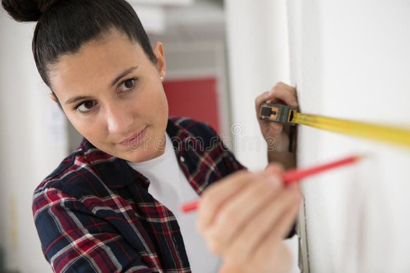 Woman with Measure Tape Working in Construction Stock Image Image of