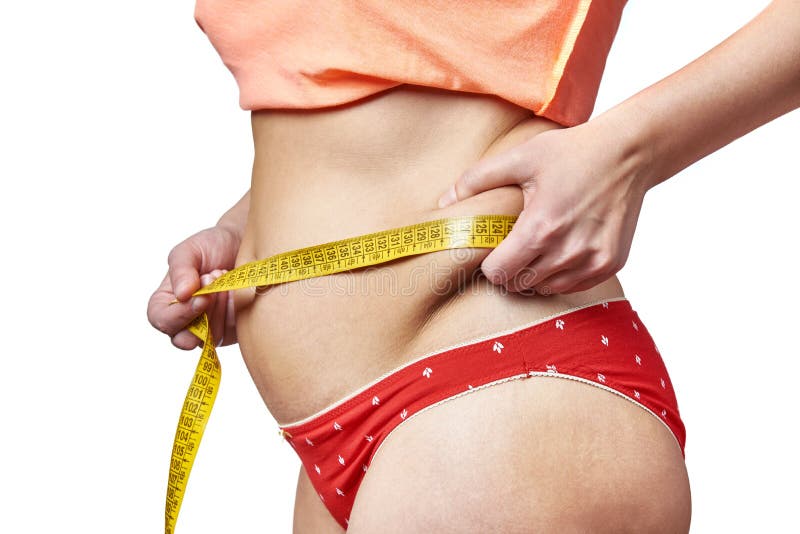 Woman measuring waist with measuring tape and showing fatty deposits