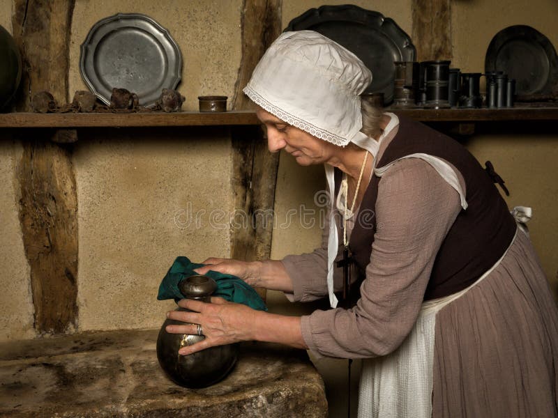 Woman in medieval outfit cleaning