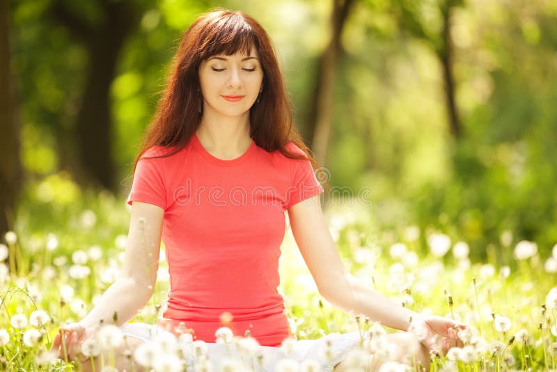 Woman meditate in the park