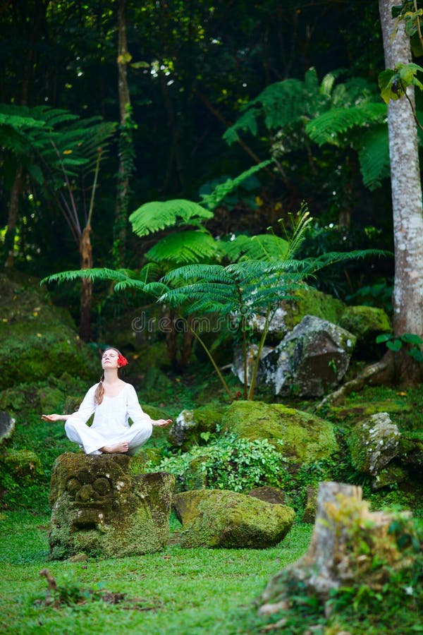 Woman meditating outdoors