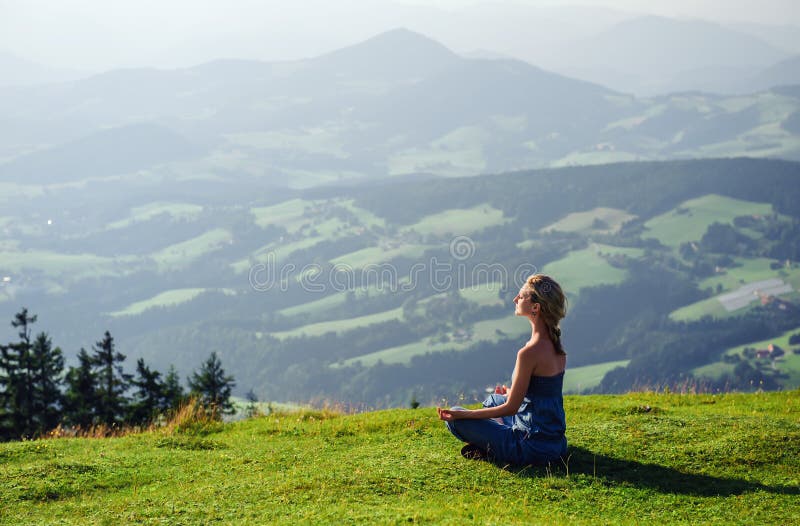 Woman meditating outdoors