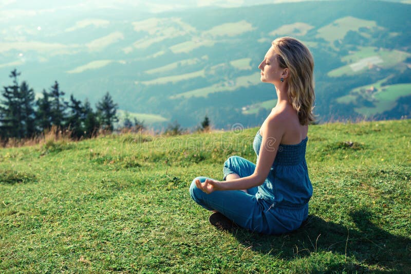 Woman meditating outdoors